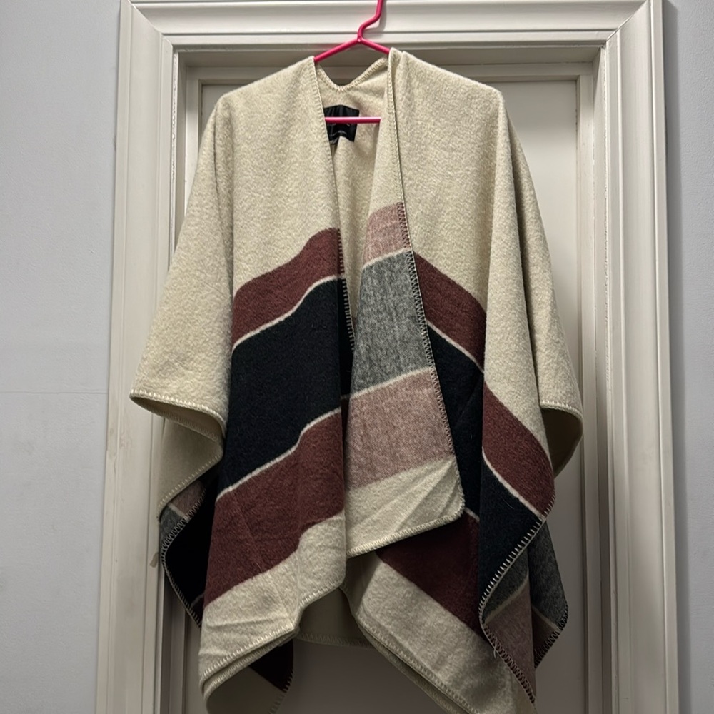 Cape with sleeves